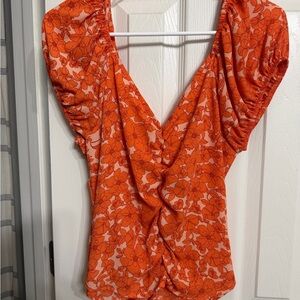 Women's Orange Floral V-Neck Twist Front Top